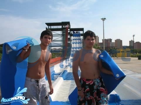 Boys holding their slide mats Aguamania
